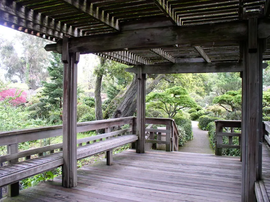 Japanese Gardens in Hayward, featuring a deck with a pergola surrounded by serene landscaping.